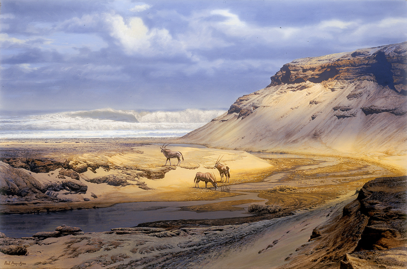 A Paul Augustinus painting of  several gemsbok standing on the bank of a river which has formed a lagoon just before reaching the ocean, which lies ibn the background