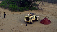 Vehicle and tent pitched in the Hoanib, Namibia