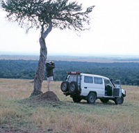 A landcruiser is parked high up an escarpment in the Mara Triangle in Kenya
